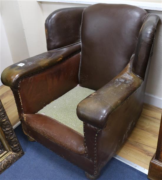 A 1940s French tan leather armchair
